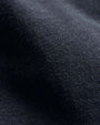 Close-up of a vintage zip-up hoodie, showcasing its fabric texture and design details.