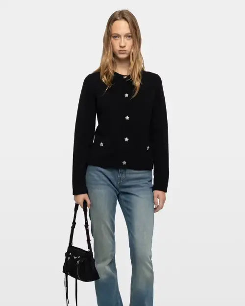 Black cardigan with silver star buttons styled with blue jeans