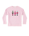 A pink long-sleeved crewneck sweatshirt displayed on a plain white background. The sweatshirt features three nutcrackers.