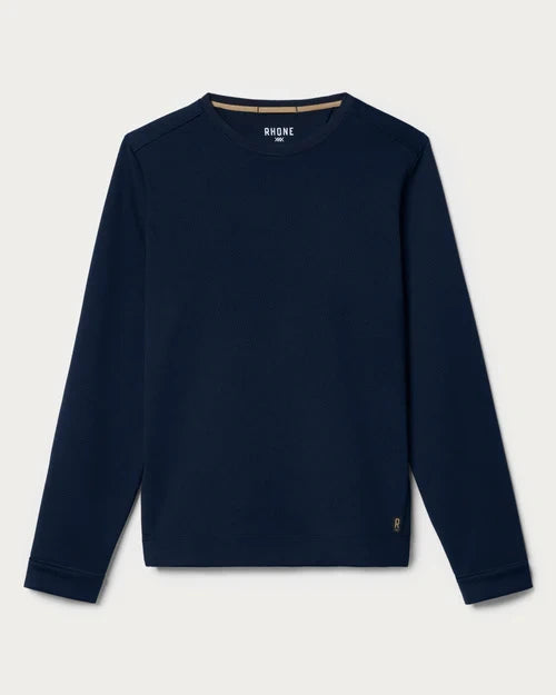 Navy long-sleeve performance crewneck shirt with a textured knit fabric and athletic fit, displayed on a neutral background.