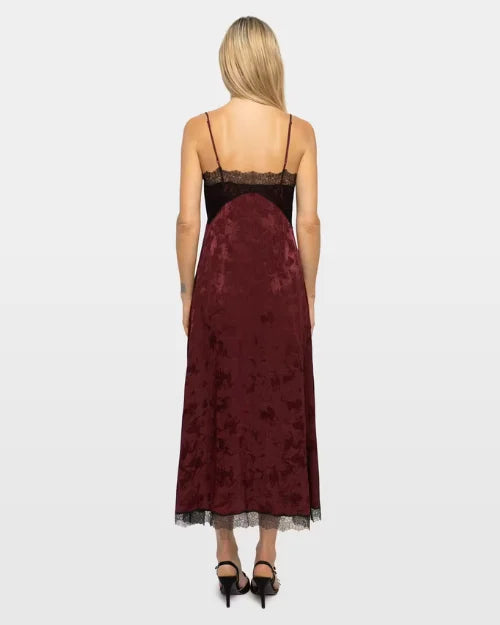 Back view of burgundy jacquard midi slip dress with black lace trim and spaghetti straps