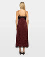 Back view of burgundy jacquard midi slip dress with black lace trim and spaghetti straps