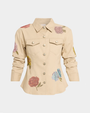 A khaki jacket with embellished flowers on a white background. 