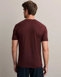 Back view of a men's burgundy athletic fit crew neck performance t-shirt