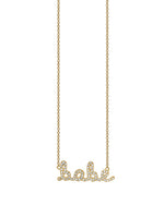 Babe script necklace with pave diamonds in yellow gold chain.