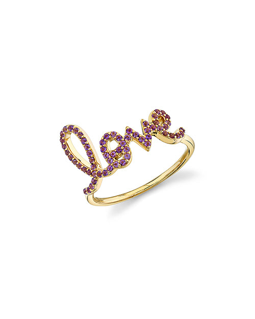 Love script ring with amethyst stones in yellow gold.