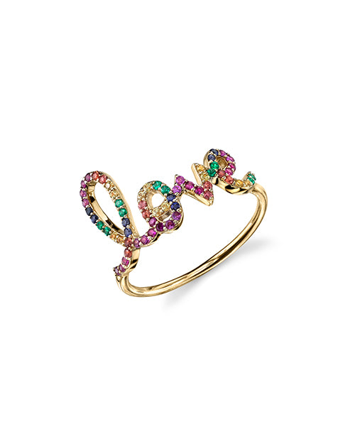 Love script ring with pavé rubies, emeralds and multi-color sapphires in yellow gold.