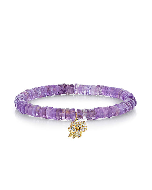 Amethyst heishi stone bracelet with magnolia charm in pave diamonds and yellow gold.