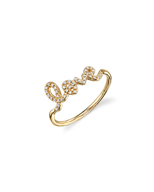 Love script ring with pave diamonds in yellow gold.