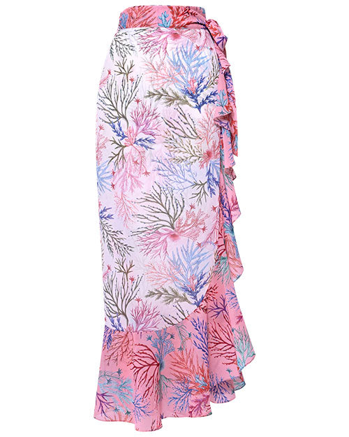 A vibrant tropical skirt featuring a ruffled hem, ideal for pairing with a tropical print bikini.