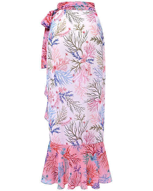 A vibrant tropical skirt featuring a ruffled hem, ideal for pairing with a tropical print bikini.
