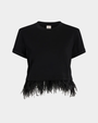 Black t-shirt with feather detail at the hem on a white background. 
