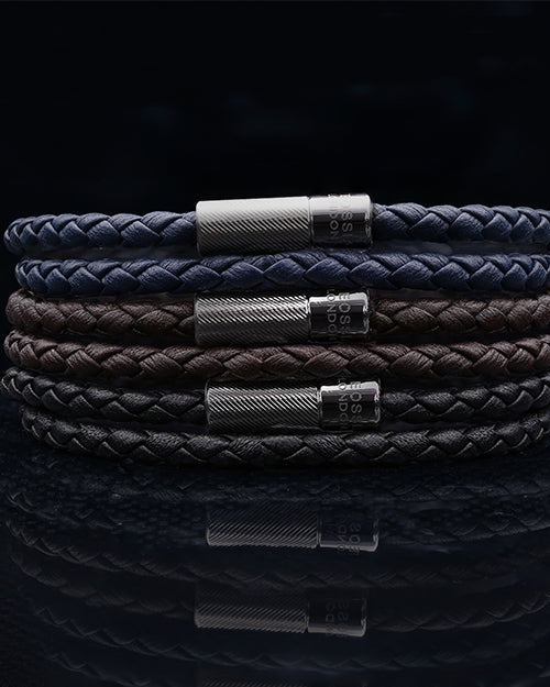 Lifestyle image showing 3 different colors of bracelet, brown navy and black.