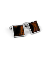 Front view. Polished Dome cufflinks in Tiger Eye stone on white background.