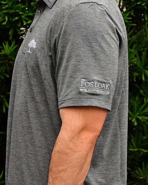 Close up of Post Oak tree and logo embroidery on left chest and sleeve cuff.