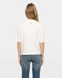 Back view of white short-sleeve graphic T-shirt with small logo at back neck