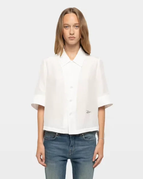 White short-sleeve button-up shirt with pointed collar and relaxed fit

