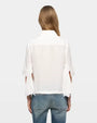 White short-sleeve button-up shirt with back slit sleeve detail, rear view