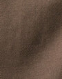 Close-up of a soft brown cashmere fabric, showcasing its rich texture and luxurious quality.