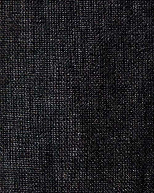 Close-up of lightweight black linen fabric, showcasing its texture and weave.