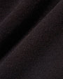  Close-up of a black fabric, showcasing the texture of a ladies' black crop tee shirt.