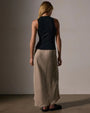 Model wearing a black tank top and long skirt, highlighting the luxurious feel of the cotton cashmere rib material.