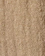 Close-up of a wool blend fabric featuring a textured weave pattern.