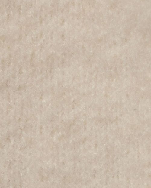 Detailed view of ivory fabric, highlighting the knit texture of an ivory sweater knit jacket.
