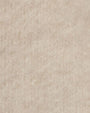 Detailed view of ivory fabric, highlighting the knit texture of an ivory sweater knit jacket.