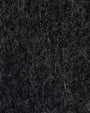 An up-close image of a waffle knit funnel neck tunic.  with dense black fibers, showcasing its rich texture and design.