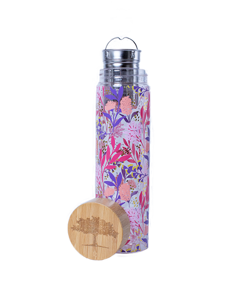 A clear cylindrical travel infuser mug with a floral pattern pink and purple. The mug includes a bamboo lid with a tree silhouette and detachable infuser.