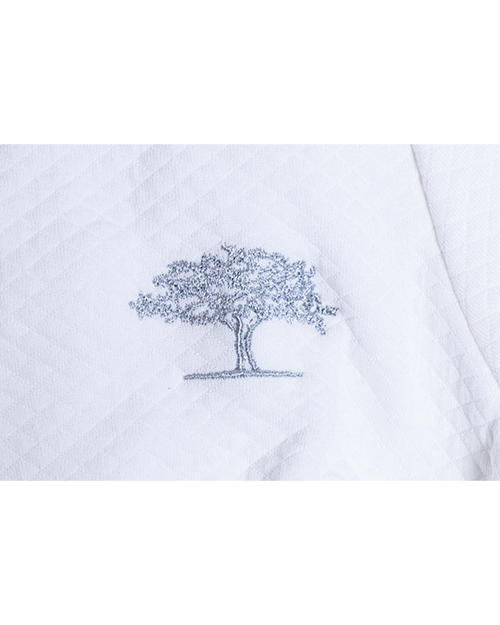 close up of Post Oak logo stitched on robe.
