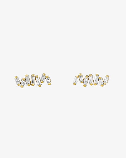 Gold earrings with small rectangular diamonds and gold dots. 