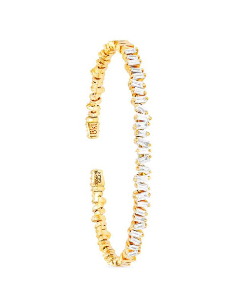 Thin gold bangle bracelet with diamonds. 