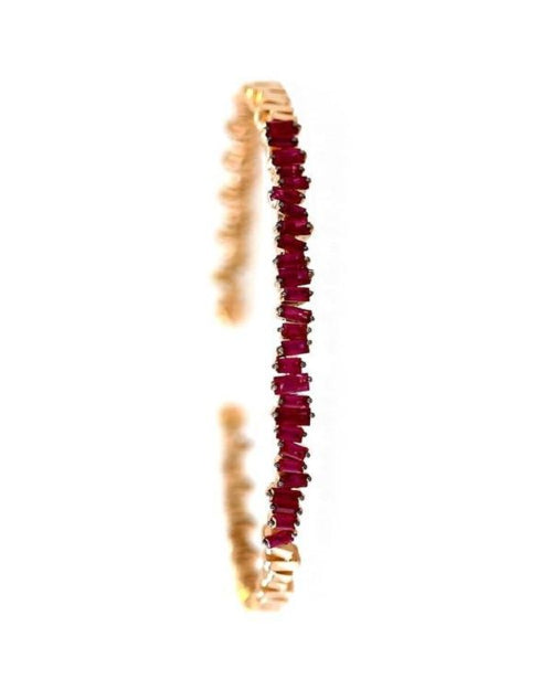 Thin gold bangle bracelet with rubies. 
