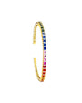 Thin gold bangle bracelet with rainbow sapphires. 