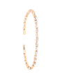 Thin rose gold bangle bracelet with white diamonds. 