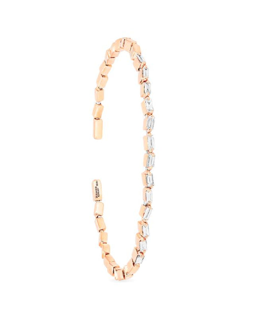 Thin rose gold bangle bracelet with white diamonds. 