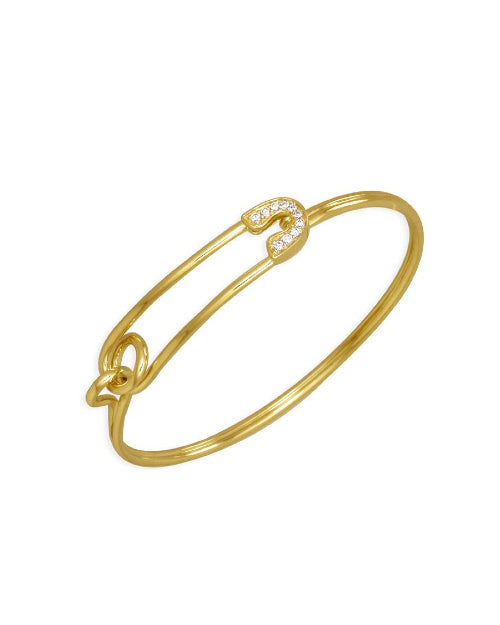 Thin gold bracelet with gold and diamond safety pin design. 