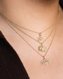 Model wearing Small Elephant necklace with other Sydney Evan jewelry pieces. 