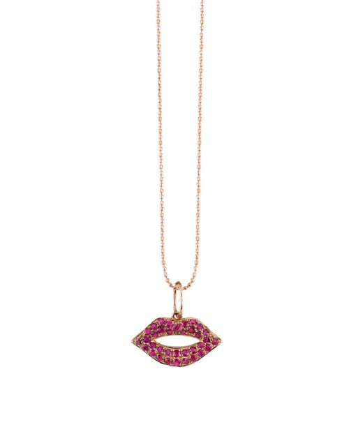 Rose gold chain with ruby lips charm. 