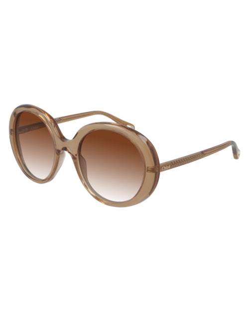 Orange Esther Woman Sunglasses in front of white background.