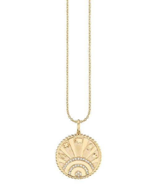 Gold chain necklace with gold and diamond coin charm.