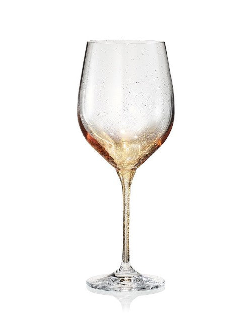 Gold Orion Wine Glass in front of white background. 