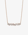 Rose gold necklace with baguette-cut diamonds in a slightly wavy line. 