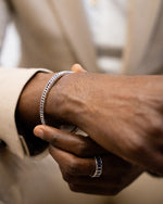 Man wearing Eternity Inlay Band Ring with Inlay Bangle Bracelet.