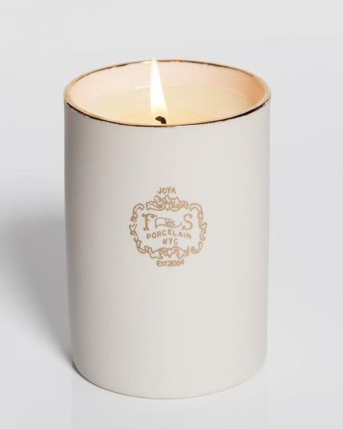 The Post Oak White Oak Candle in front of white background.