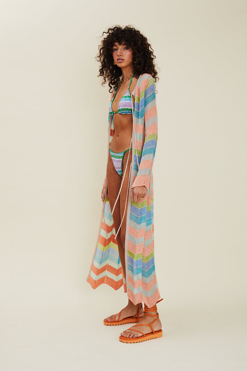 Side view of model wearing Solar Tie Front Maxi Cardigan.
