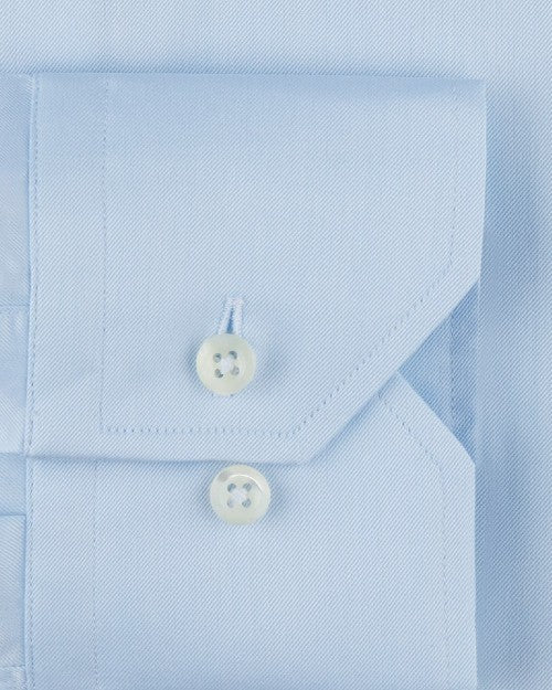 Close up of 2 buttons on sleeve cuff. 