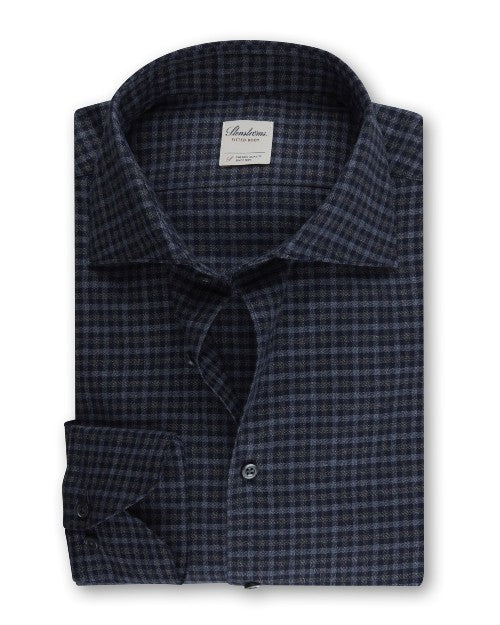 Checked Pattern Shirt in blue folded in front of white background.